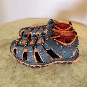 Toddler sneaker/sandals with Velcro closure. Black/orange.